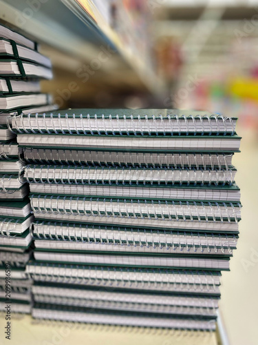 Canvastavla Stack of spiral-bound notebooks with white pages and green covers arranged neatl