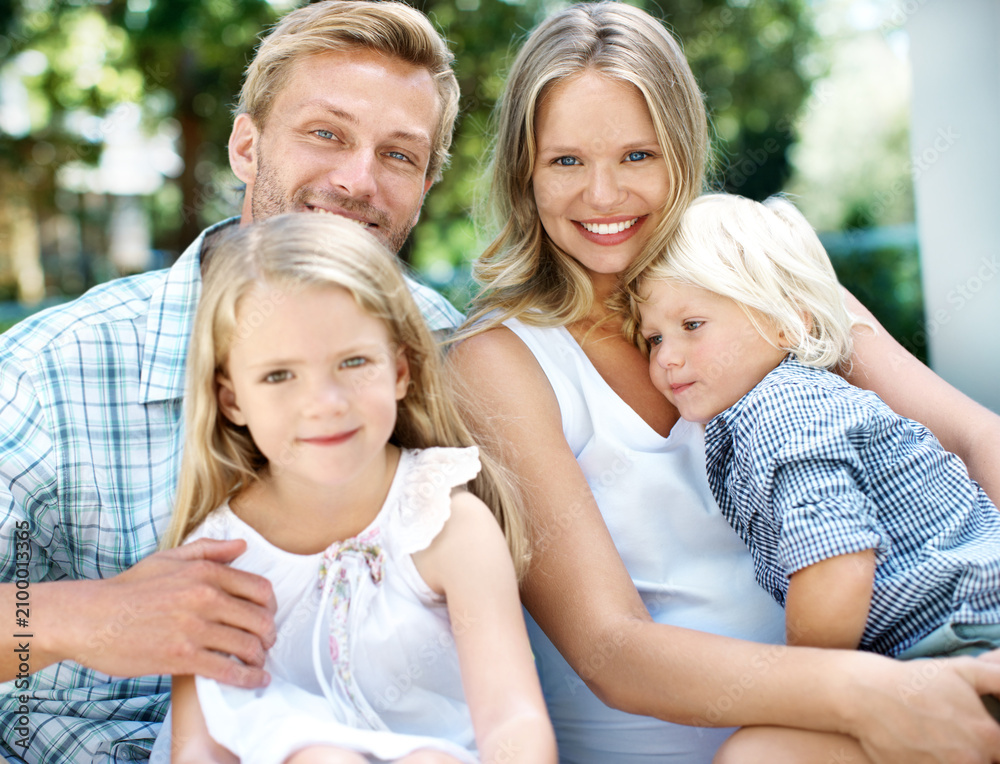 Fototapeta premium Happy, parents and kids with love in backyard for weekend break, bonding together and support. Care, people and children portrait in home garden for family connection, healthy relationship and trust
