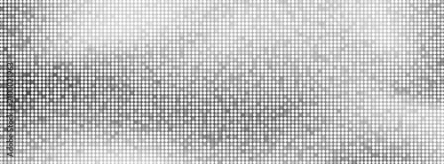 Silver mosaic background of small, shimmering square tiles of a disco ball