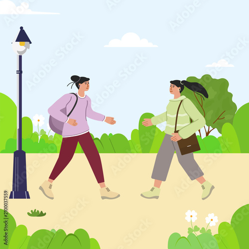 Two young women walking in park with smiles, surrounded by greenery, lamppost, and clear sky