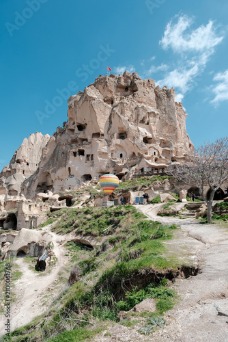 фотографія Breathtaking view of Uchisar Castle in Cappadocia, Turkey under a vibrant blue s