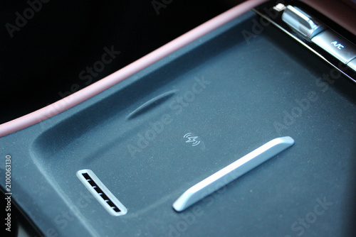 Close up of a wireless charging tray inside a new vehicle