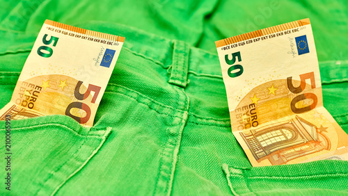 Konstfotografi Insurance.Two 50 euro banknote in green jeans pockets