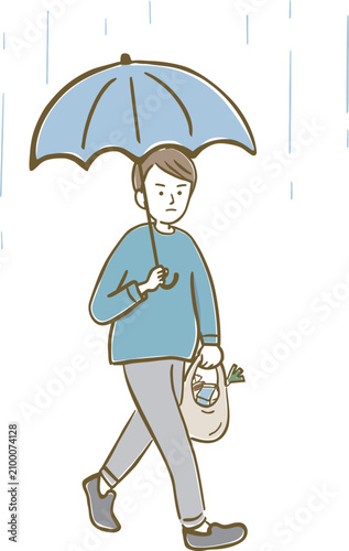雨の日に傘をさし、買い物袋を持って歩く男性
