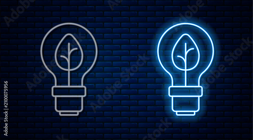 Tableau sur toile Glowing neon line Light bulb with leaf icon isolated on brick wall background