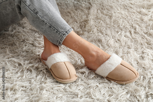 Womans feet in cozy beige a...