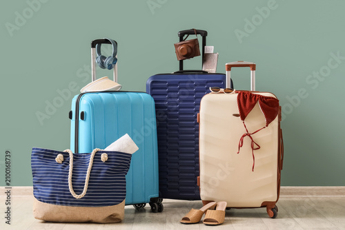 Three colorful suitcases wi...