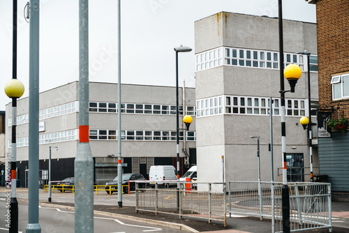 Corby, Northamptonshire, United Kingdom - July 15, 2026: Urban street with office buildings and Belisha beacons in Corby town centre