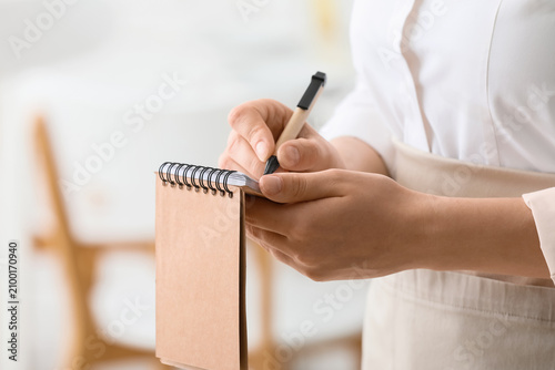 Waitress or server taking a...