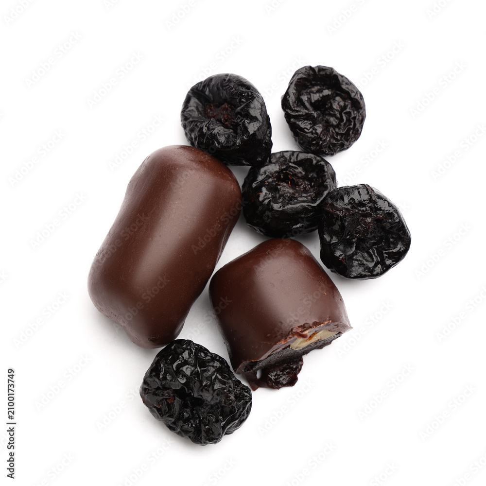 Obraz premium Sweet chocolate covered prunes on white background