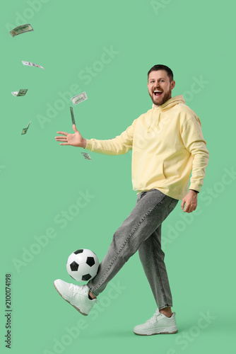 Happy young man with soccer...