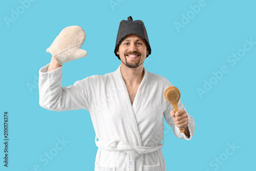 Handsome man in sauna felt ...