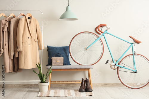 Rack with autumn clothes, b...