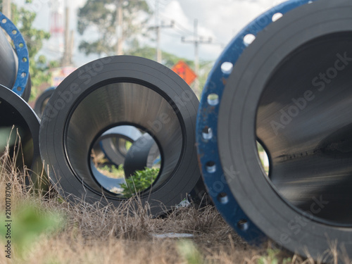 Fotografie High-density polyethylene (HDPE) or steel pipes are used for high-pressure water supply these blue, flanged and bolted pipes are installed both above and below ground
