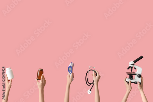 Female hands with microscop...