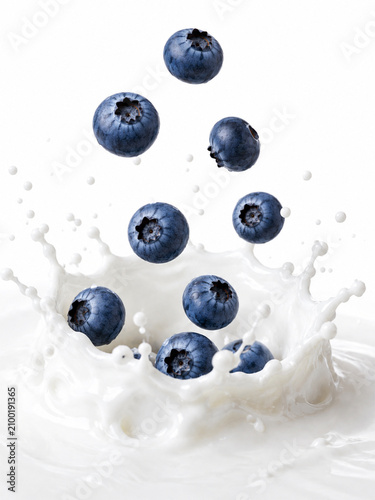 Blueberries Splashing into Fresh Milk