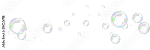 Fotografie A collection of realistic transparent soap bubbles with iridescent reflections isolated on white