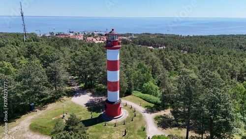 фотографія Aerial view of Nida lighthouse surrounded by lush pine forest in Curonian Spit national park, Lithuania