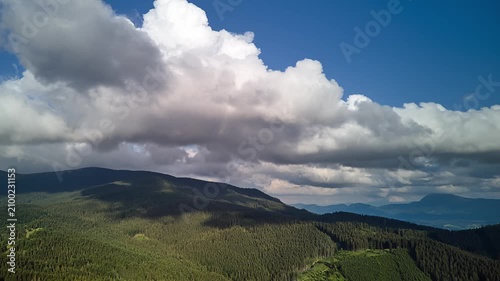 Aerial Hyperlapse Forward Flight With Yaw Over Mountain Forest Cumulus Clouds Summer