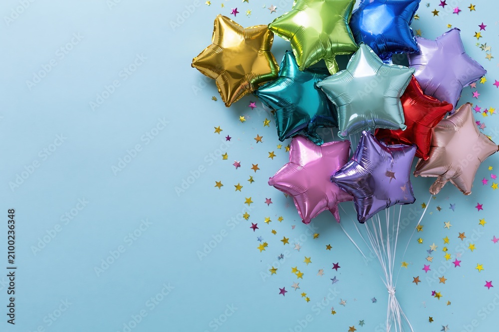 Fototapeta premium The Star-Shaped Balloons Celebration with Metallic Colors Against a Bright Blue Backdrop