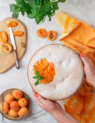 Homemade apricot pie. Charlotte. Fresh delicious pastries. Selective focus, top view