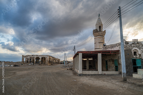 Historic ruins stand on Suakin Island as clouds gather over Sudan's Red Sea coast