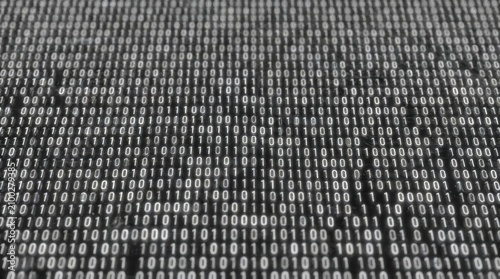 Infinite rows of glowing white binary code on dark background