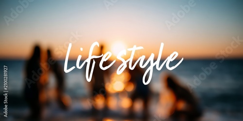 A group of silhouettes enjoying a sunset on the beach, embodying a carefree lifestyle