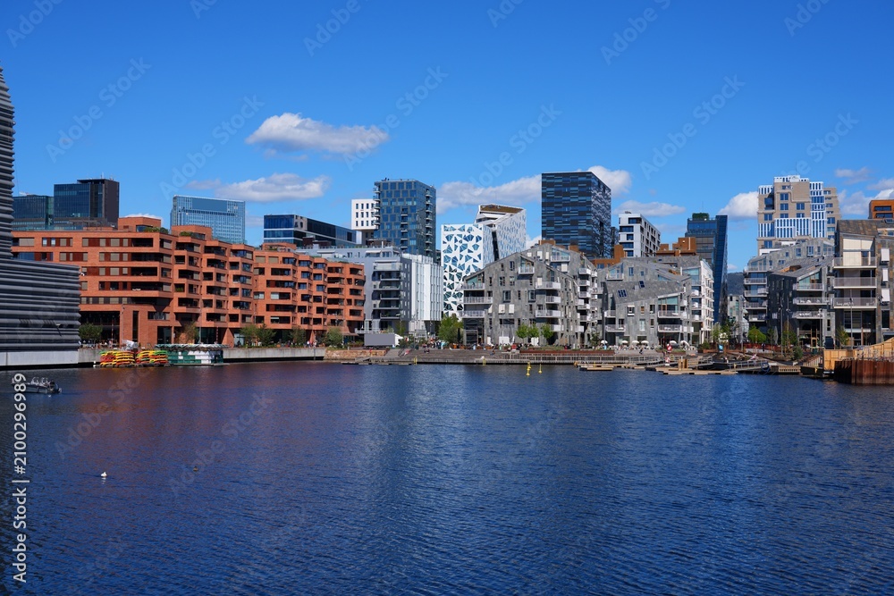 Fototapeta premium Bjorvika waterfront skyline in Oslo city, Norway. Modern district photo on a sunny day.