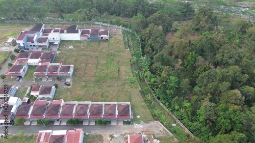 Aerial Drone Footage of Residential Neighborhood Bordering Tropical Forest and Open Land