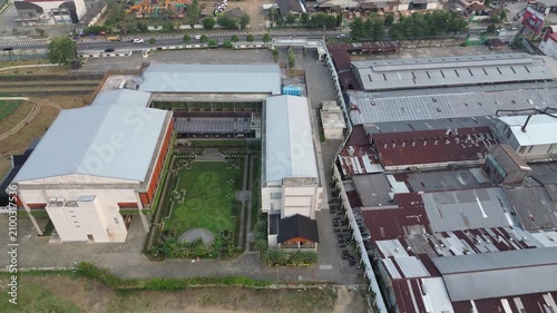 Aerial Drone Footage of Industrial Warehouse Complex and Factory Buildings in Urban Area