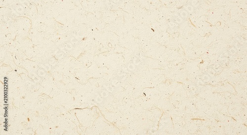 High-resolution macro shot of a grainy recycled paper surface with visible natural fibers and a subtle cream-colored textured background, speckled, sepia, sheet