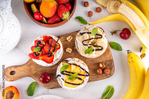 Rice Crackers Healthy diet sandwiches with fruits and berries