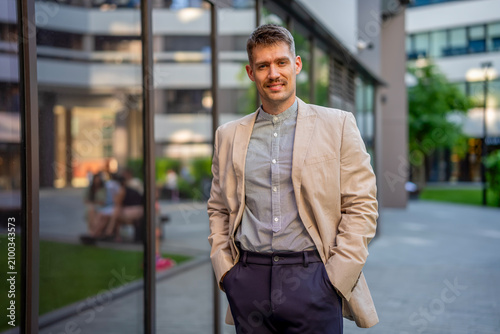Confident young man posing outdoors
