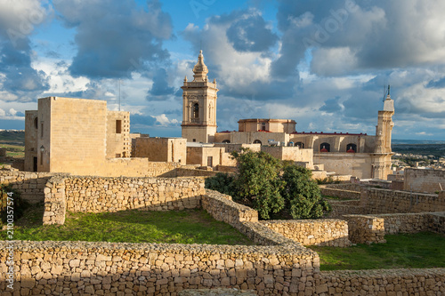 Cathedral of the Assumption stands in the Cittadella of Victoria, overlooking the landscape of Gozo Island, Malta