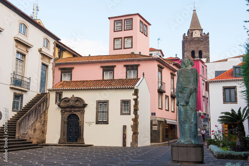 Trilogy of Power bronze statue stands in a small square at Rua dos Capelistas and Rua da Alfandega in Funchal, Madeira, Portugal