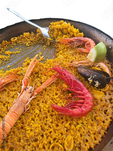 Seafood paella isolated. Traditional Spanish rice dishes in restaurants. Rice, prawns and mussels. Healthy eating on the Mediterranean Sea. Spain, Costa Blanca, Alicante.