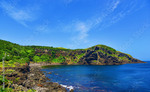 Scenic view of Udo Island with clear blue sky and rocky coastline in South Korea