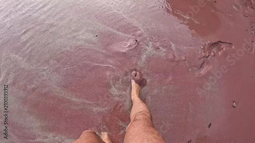 Foot Pressing Soft Pink Sand on Tropical Beach in Brazil