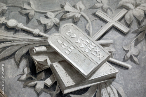 Tablets of the law depicted in Saint Agatha Church in Rumilly, France, showing the 10 commandments and religious symbols