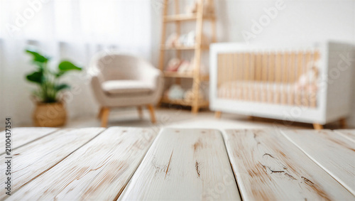 Fotografía Empty wooden table foreground with blurred baby nursery background interior back