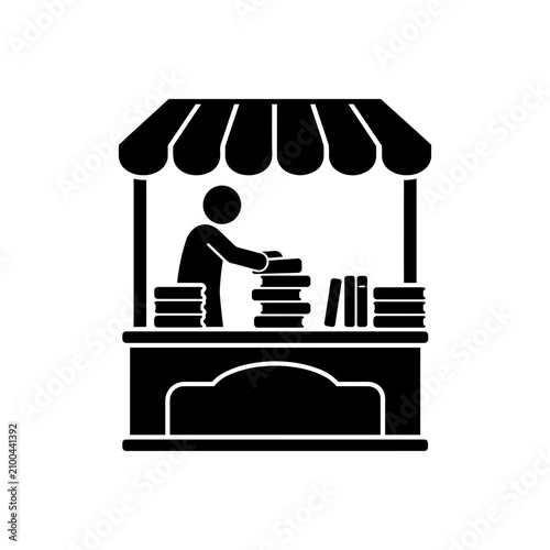 Black silhouette of a person standing on a ladder indoors