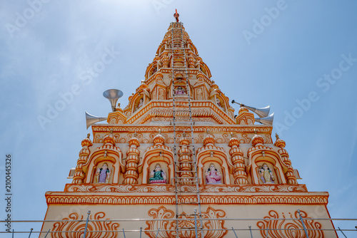 Hindu Temple showcasing the beautifully carved spires (shikhara) of the Malganga Devi, located on the banks of the Kukadi River near the famous natural rock potholes in Nighoj, India.