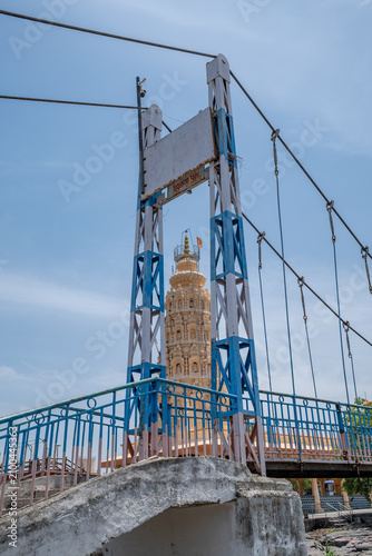 Hindu Temple showcasing the beautifully carved spires (shikhara) of the Malganga Devi, located on the banks of the Kukadi River near the famous natural rock potholes in Nighoj, India.