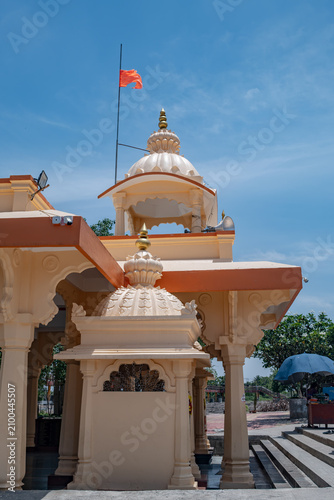 Hindu Temple showcasing the beautifully carved spires (shikhara) of the Malganga Devi, located on the banks of the Kukadi River near the famous natural rock potholes in Nighoj, India.