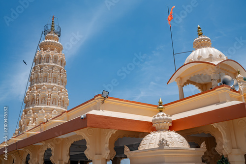 Hindu Temple showcasing the beautifully carved spires (shikhara) of the Malganga Devi, located on the banks of the Kukadi River near the famous natural rock potholes in Nighoj, India.