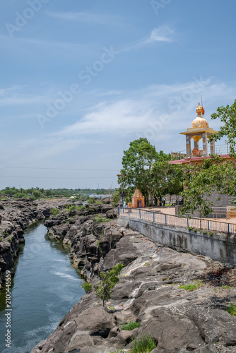 Hindu Temple showcasing the beautifully carved spires (shikhara) of the Malganga Devi, located on the banks of the Kukadi River near the famous natural rock potholes in Nighoj, India.
