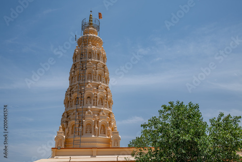 Hindu Temple showcasing the beautifully carved spires (shikhara) of the Malganga Devi, located on the banks of the Kukadi River near the famous natural rock potholes in Nighoj, India.