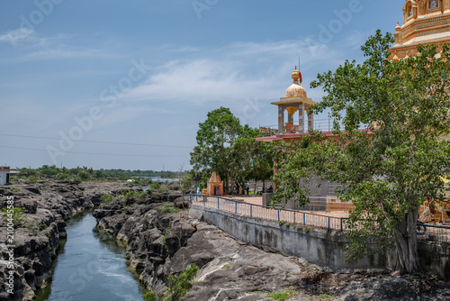 Hindu Temple showcasing the beautifully carved spires (shikhara) of the Malganga Devi, located on the banks of the Kukadi River near the famous natural rock potholes in Nighoj, India.