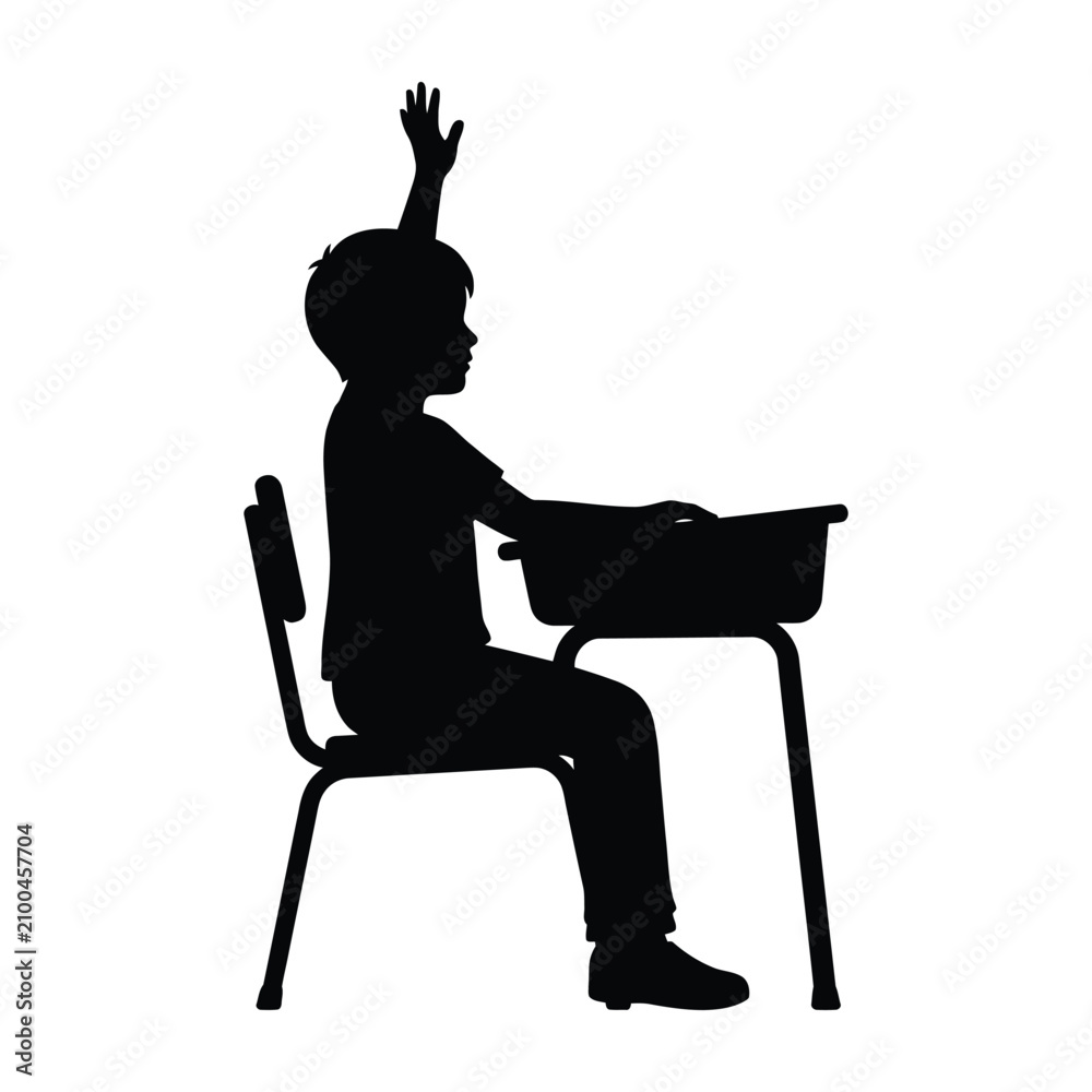 Fototapeta premium Silhouette of a schoolboy raising hand while sitting at a desk
